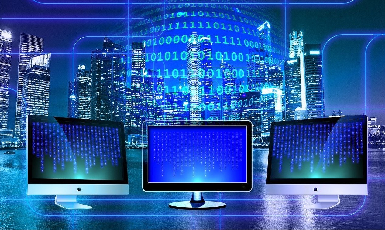 Image of binary code and PC monitors